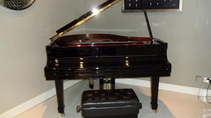 Grand piano moved and set up by Britannia Appleyard